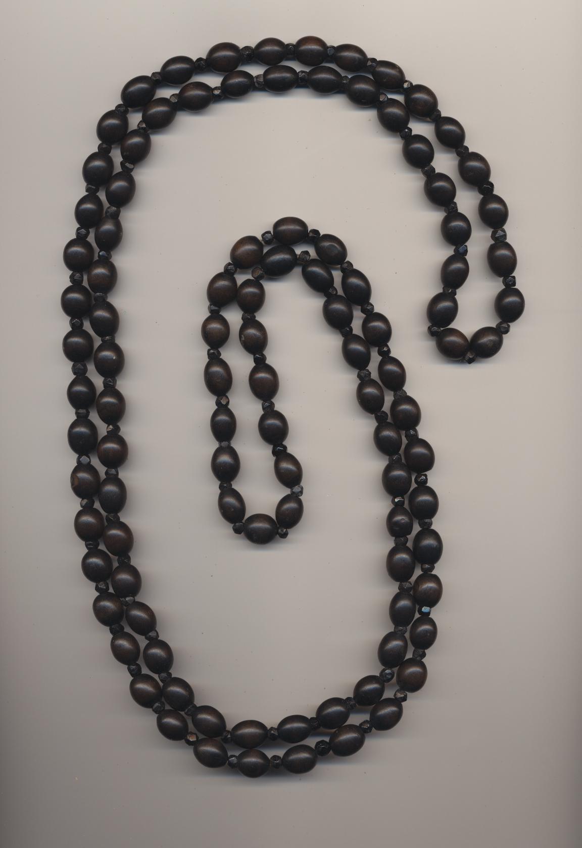 Antique mourning necklace of hand made ebony wood beads and small French jet glass beads, ca.1900, length 59'' 150cm.